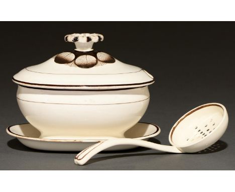 A Wedgwood Queen's Ware sauce tureen and cover and creamware straining ladle, c1840 and earlier, tureen and cover 12cm h, imp