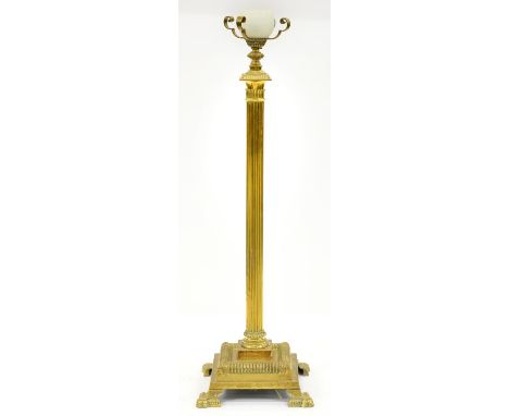 An Edwardian brass columnar floor lamp, formerly with telescopic action, converted to electricity, 130cm h  Drilled hole in b