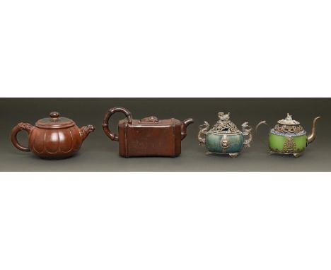 Two Chinese Yixing stoneware tea pots and covers and a Chinese metal and enamel mounted green stone teapot and cover and a si