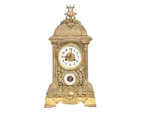 A French cast brass mantel clock, late 19th c, with aneroid barometer and primrose enamel dial, in square case with domed top