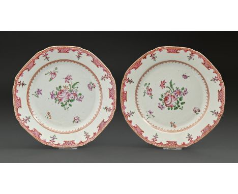 A pair of Chinese export porcelain octagonal famille rose plates, c1780, painted with flowers in red and gilt spearhead cavet
