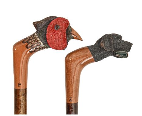 Two walking sticks, James Purdey &amp; Sons Ltd, London, the carved and painted wood handle as the head of a gundog or pheasa