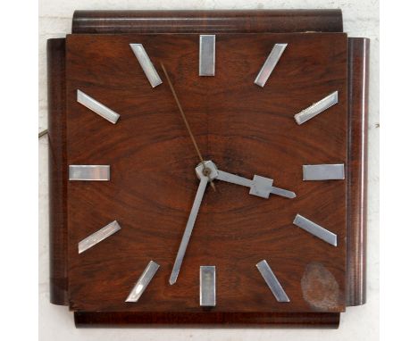 An Art Deco electric wall timepiece, with chromium plated hands and chapters, 32 x 32cm Mahogany veneer.  Clock untested as c