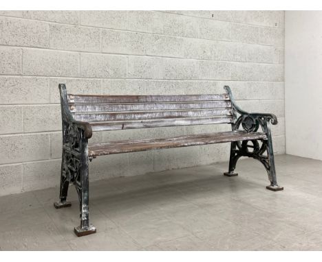 A heavy painted cast iron bench with distressed teak slats by Furnitube dated 1994. H.85 W.164 D.60cm