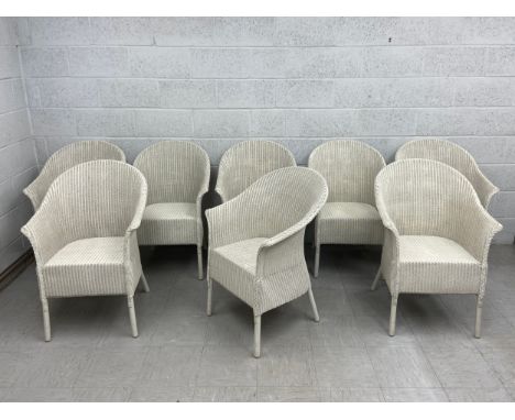 A set of eight 20th century Lloyd Loom style painted wicker tub chairs. H.90cm