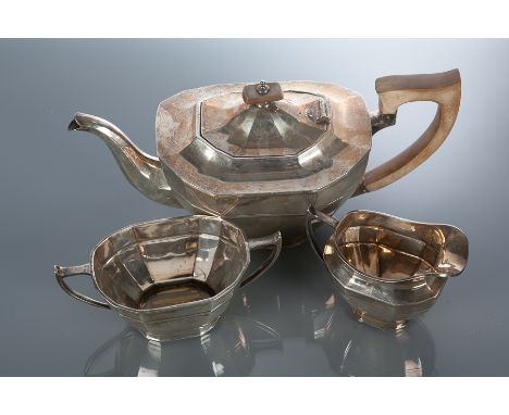 SILVER THREE PIECE TEA SERVICE
maker Cooper Brothers & Sons Ltd., Sheffield 1937, of faceted oval form, approximately 1048g, 