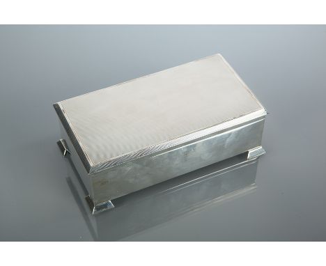 SILVER CIGARETTE BOX
maker S. J Rose & Son, Birmingham 1962, engine turned lid, approximately 540g (base loaded), 17cm long