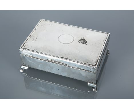 SILVER JEWELLERY BOX
marks rubbed, date letter O, with engine turned lid, fitted blue velvet interior, on four bracket feet, 