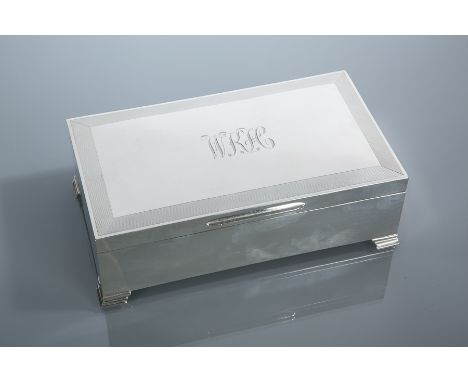 SILVER CIGAR BOX
makers mark T.F., Birmingham 1977, engine turned lid, engraved with initials 'WKH', approximately 1192g (bas