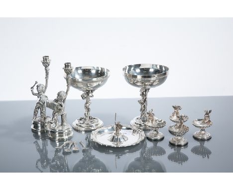 COLLECTION OF NOVELTY SILVER PLATED ITEMS
including a pair of wine cups with satyr figure stems, each 11.5cm high; a Don Quix