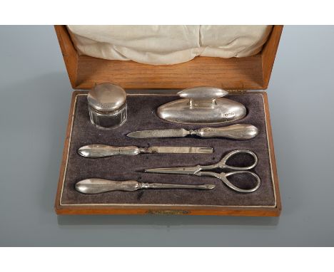 SILVER SIX PIECE MANICURE SET
maker M J Myatt & Co., Birmingham 1912, including nail buff, small lidded jar and files, scisso