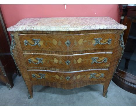 A French Louis XV style kingwood and marquetry inlaid bombe commode with serpentine top