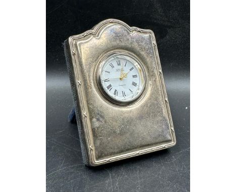 A silver easel backed clock by R Carr, hallmarked for Sheffield. H 9cm