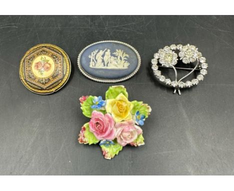 A selection of costume brooches to include a Wedgewood Jasperware brooch 