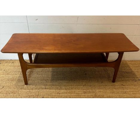 A teak Mid Century coffee table with shelf under (H40cm W116cm D40cm)