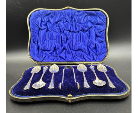 A cased set of six teaspoons with shell bowls and a pair of sugar nips, hallmarked for London 1902 by William Hutton & Sons L