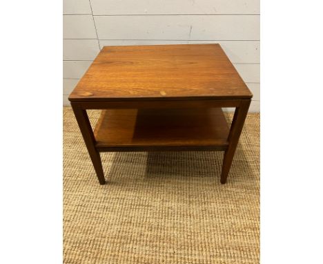 A Mid Century teak side table on tapering legs and shelf under (H48cm W61cm D54cm)