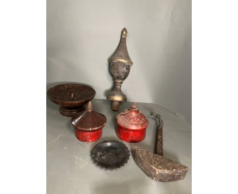 A selection of wooden decorative items including lidded pots and turned finial 