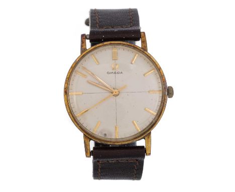 OMEGA, EIGHTEEN CARAT GOLD MANUAL WIND WRIST WATCH .the round dial with baton hour markers, 32mm case, on a brown leather str