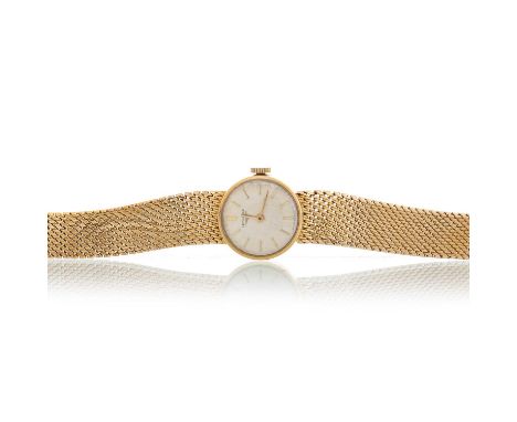 LONGINES, NINE CARAT GOLD MANUAL WIND WRIST WATCH the round dial with baton hour markers, 17mm case, on a nine carat gold bra