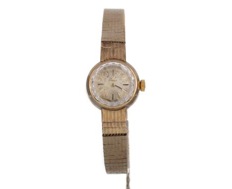 OMEGA, NINE CARAT GOLD MANUAL WIND WRIST WATCH the round dial with baton hour markers, 17mm case, on a nine carat gold bracel