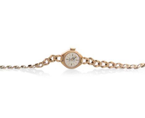 TALIS, NINE CARAT GOLD MANUAL WIND WRIST WATCH the round dial with baton hour markers, 20mm case, on a nine carat gold bracel