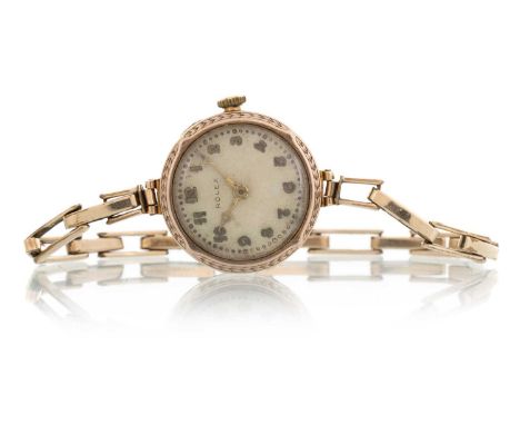 ROLEX,  NINE CARAT GOLD CASED MANUAL WIND WRIST WATCH the round dial with Arabic hour markers, 25mm case, on a rolled gold ex