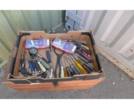 An assortment of car mechanic tools with air gun and thread repair kits. 