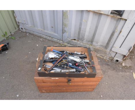 An assortment of tools including gear box dipstick, hammer and spanners. 