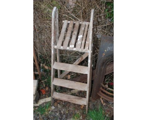 A four rung step ladder.