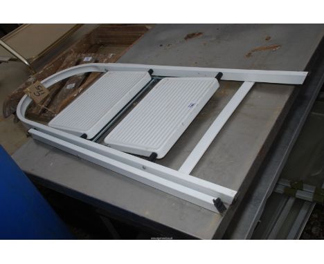 A two rung step ladder, white.