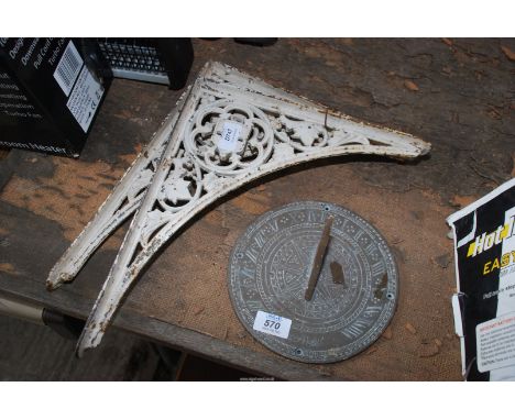 Cast iron brackets and a modern brass sundial, 7 1/2'' diameter.
