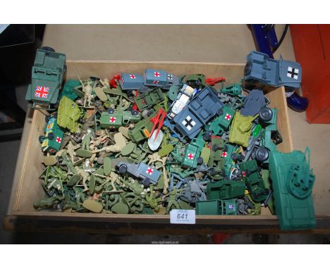 A box of plastic army vehicles and soldiers.