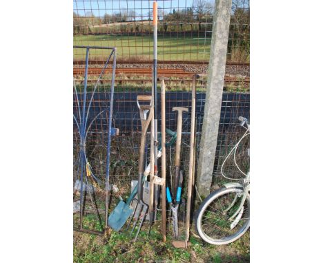 A quantity of garden tools, hoes, stainless steel fork, rakes, shears, etc.