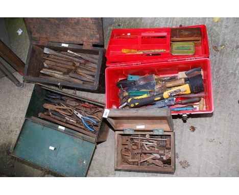 Four boxes containing various gouges, chisels, pliers and tools including a Workzone Axe.