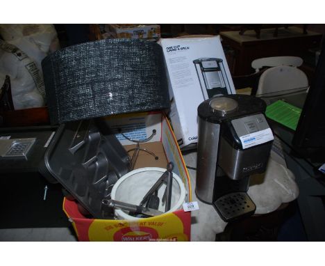 ***  A new coffee machine in box, lamp shade, cutlery tray and plant pot.