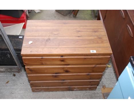 A wooden trunk, 25 1/2" wide x 14 1/2" deep x 23 1/2" high.
