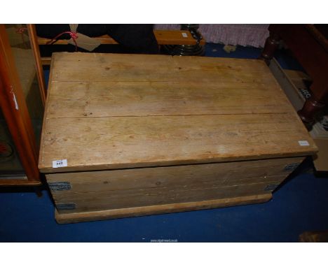 A Pine trunk on castors, 36 1/2" wide x 20 1/2" deep x 17 1/2" high.