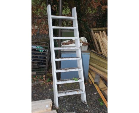 An eight rung ladder, 20 1/2" wide x 69" long.