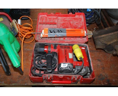 Two packs of chainsaw files 8'' x 1/4'', and a 110 volt Hilti gun (not working).