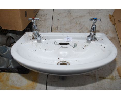 A small Fordham hand basin with taps.