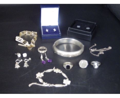 5 pairs of silver earings, a silver hallmarked bangle (Birmingham 1963) clasp broken, a chain, two bracelets and 4 silver rin