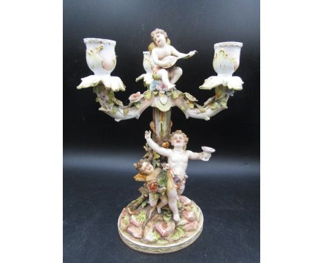 German 19thC Volkstead porcelain candlestick decorated with encrusted flowers and cherubs, good condition with very minimal l