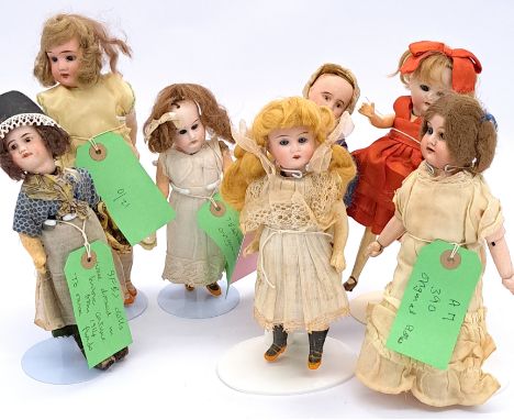 Assortment of French and German bisque dolls, many in original clothing; including Simon &amp; Halbig, Kammer &amp; Reinhardt