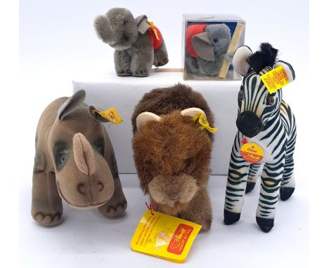 Steiff assortment including Nosy Rhinoceros and Ossi Zebra, plus Pom Pom 100th Anniversary Steiff elephant; mix of plush, Tre