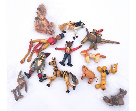 Assortment of vintage wooden articulated figures, including circus characters and animals, c. 1930s, possibly Eastern Europea