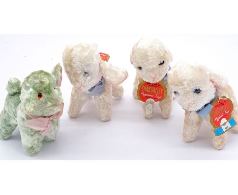 Chad Valley group of artificial silk lambs, late 1950s-early 1960s; plastic eyes, 3x white and 1x green, with original card t