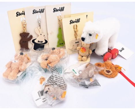 Steiff Arco and keyrings including: (1) Arco plush polar bear on wooden wheels, yellow tag 048791; 6.5"/16cm high; (2) plush 