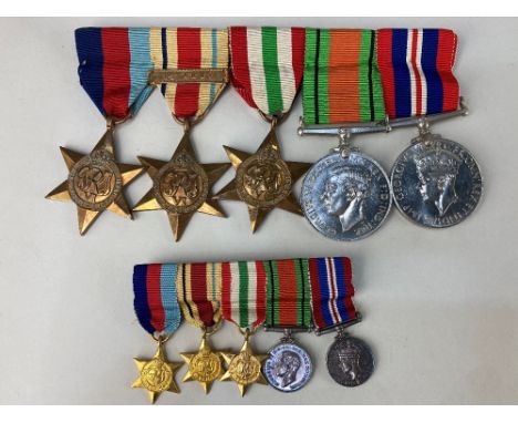 A bar of five World War II medals, 1939-45 Defence and War medals, the 1939-45 star, and the Italy and Africa stars with 1st 