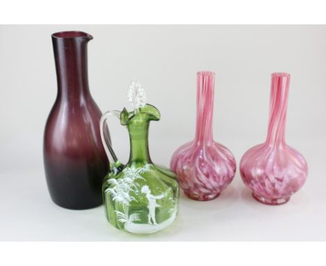 A 19th century Mary Gregory type green glass claret jug, decorated with a youth amongst countryside, 21cm high (matched stopp